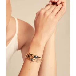 Pulsera rígida bañada en oro 18k con cristales grises Uno de 50